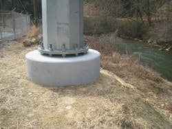 Concrete drilled shaft foundation supporting galvanized steel pole. Concrete drilled shaft foundation supporting galvanized steel pole.