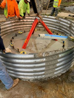 Reinforcing cage with TIP wires installed in a slurry filled excavation. Reinforcing cage with TIP wires installed in a slurry filled excavation.