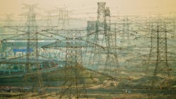 Power lines cross the landscape near Dubai, United Arab Emirates. Power lines cross the landscape near Dubai, United Arab Emirates.