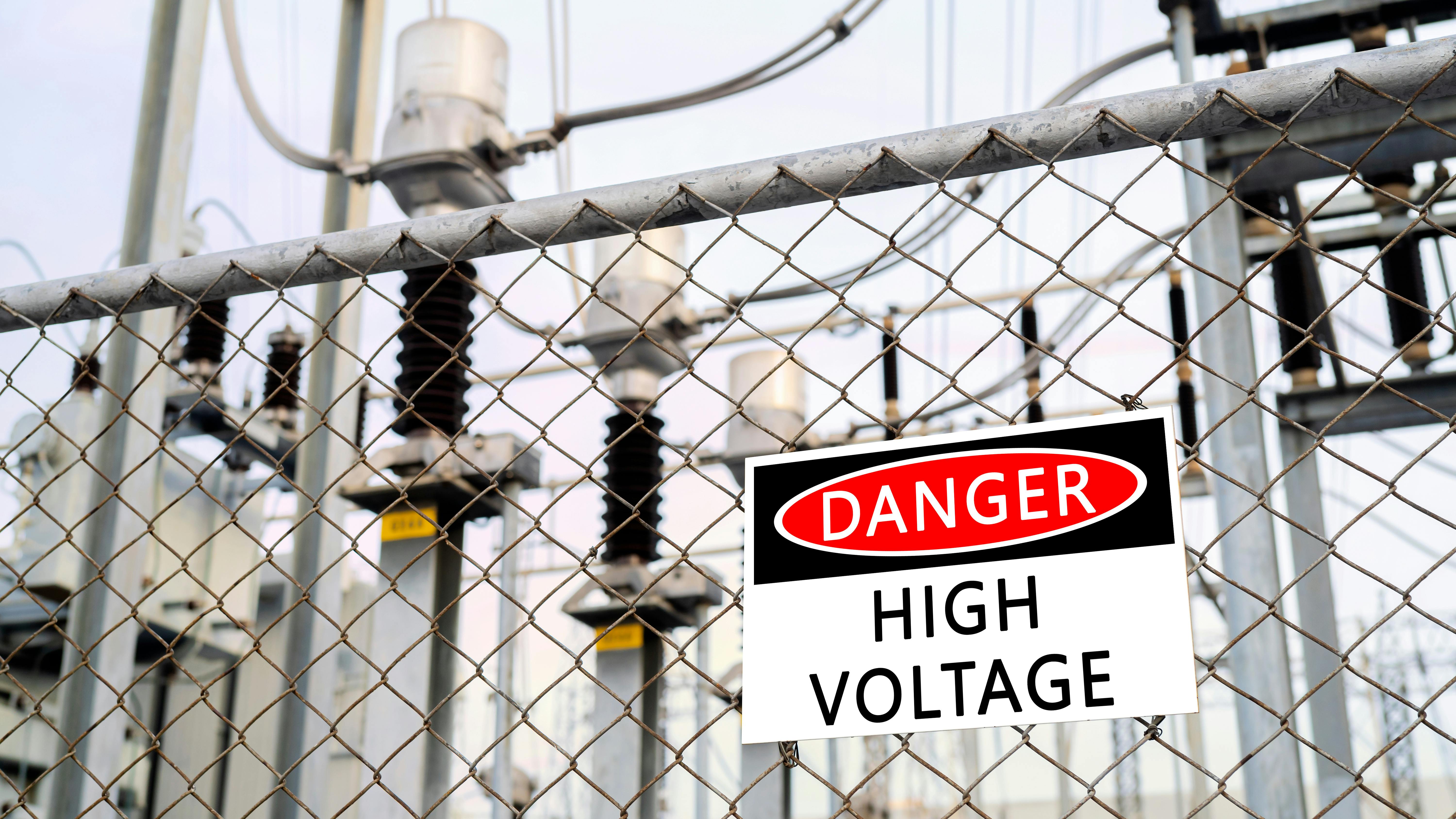 fence with danger sign