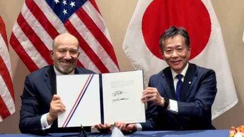 The signing of the MoU between Hitachi and DOC on strengthening the power grids.