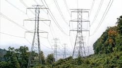 Grid of power lines and towers in a rural area. Grid of power lines and towers in a rural area.