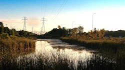A pond by Bishop Grandin greenway photographed at sunrise A pond by Bishop Grandin greenway photographed at sunrise