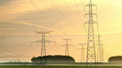 Sunrise with an electricity pylon and nature