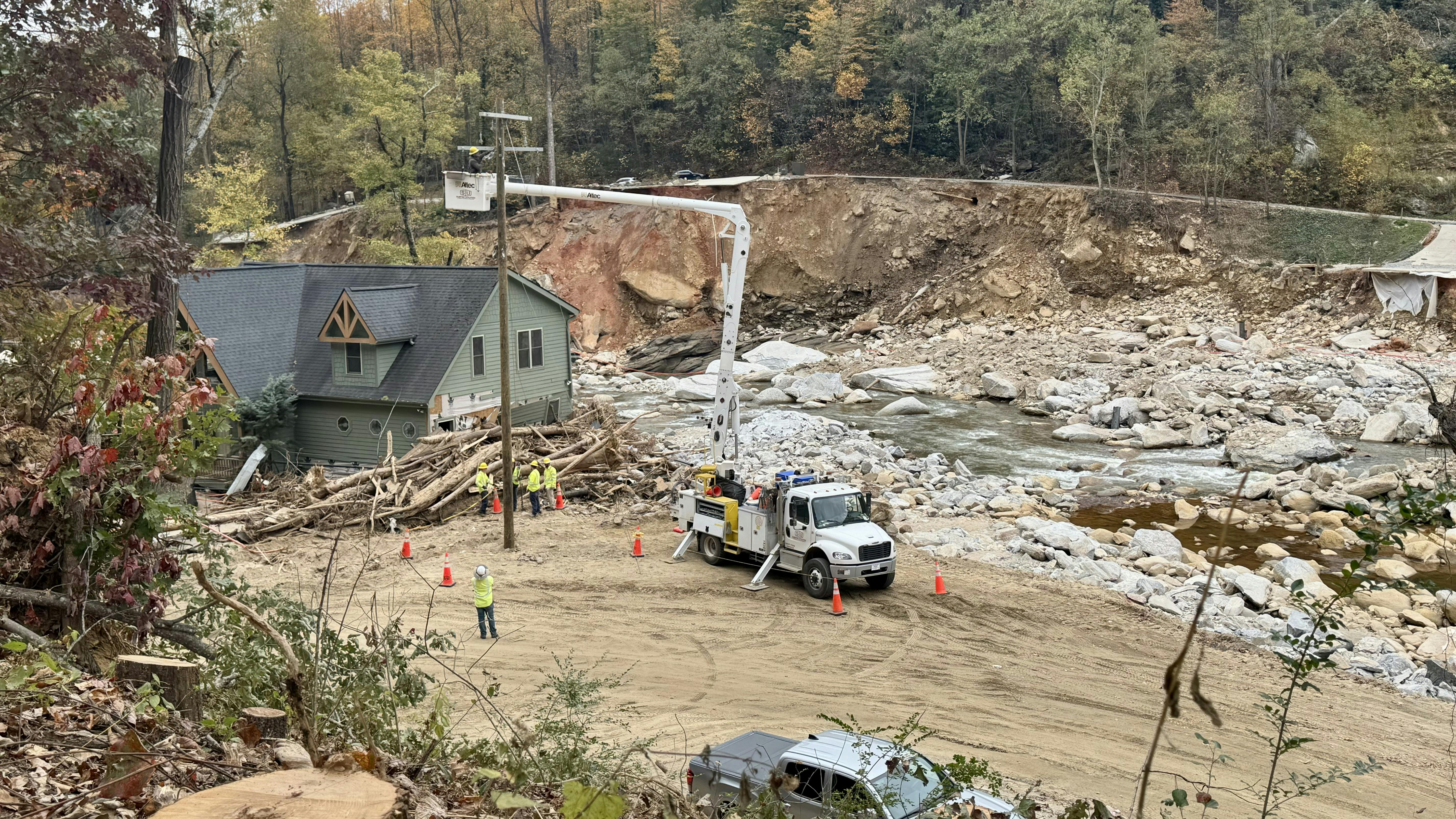 Duke Energy contractors work to get the backbone feeder up in Chimney Rock, Norh Carolina.