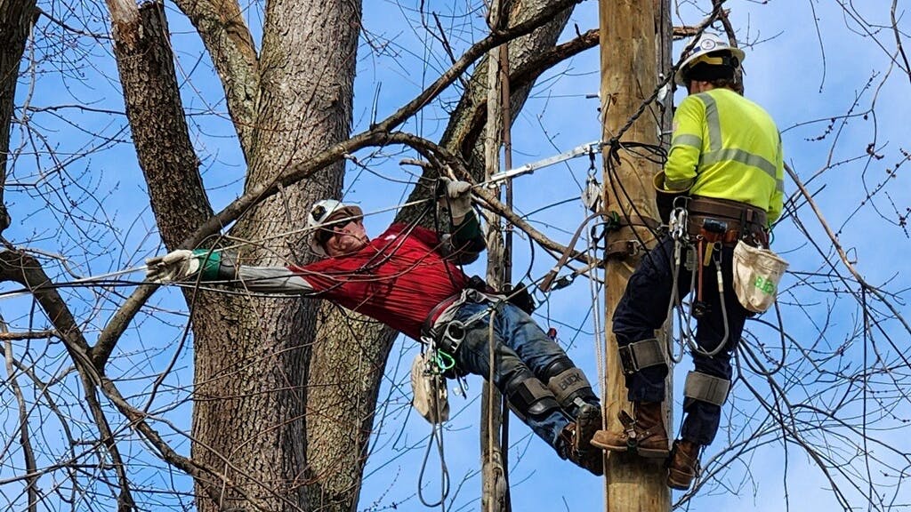 Scott Lee Woodruff, left, has worked as both a telecom and electrical lineworker during his career in the trade.