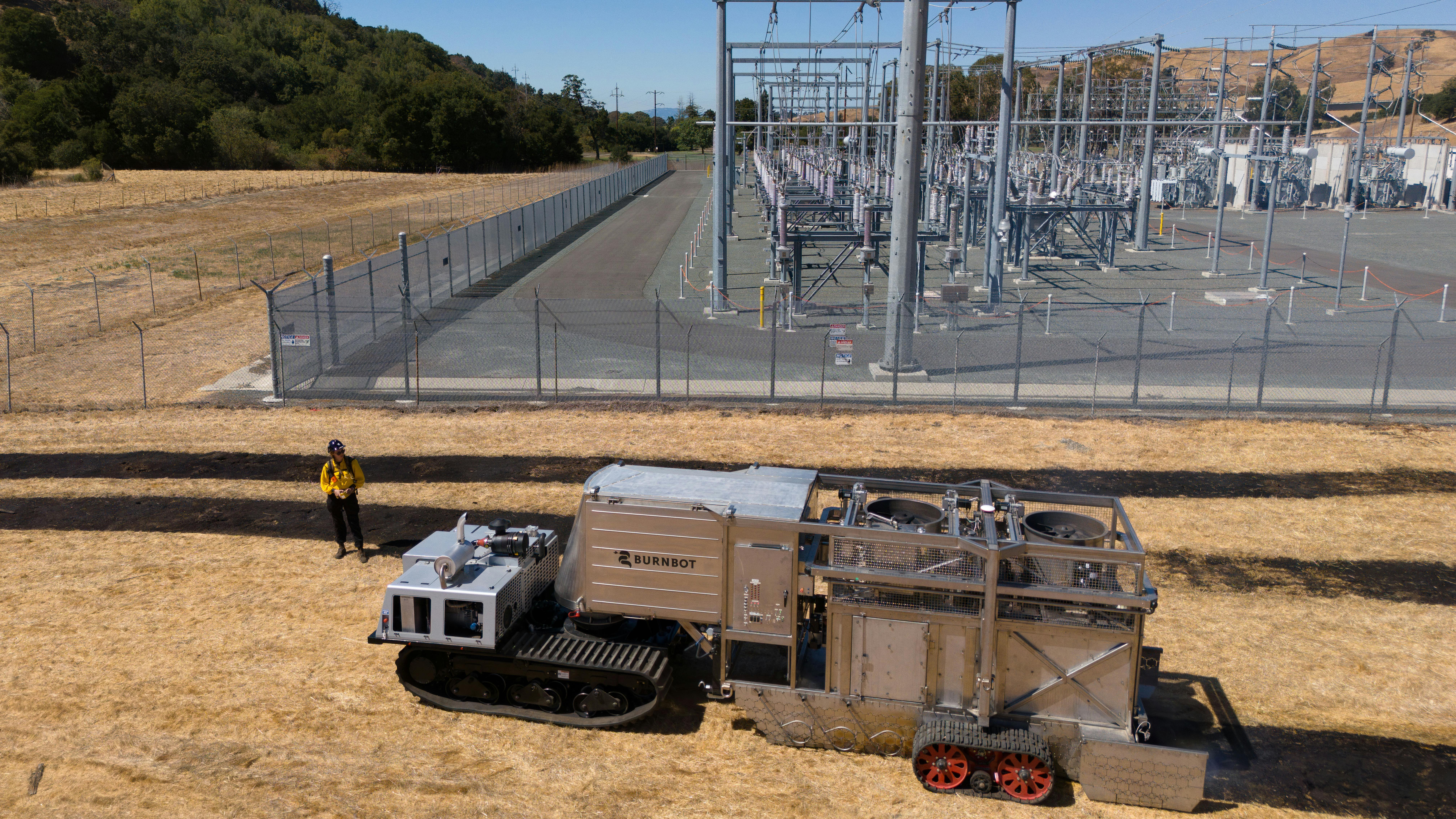 Burnbot making fire breaks at a substation.