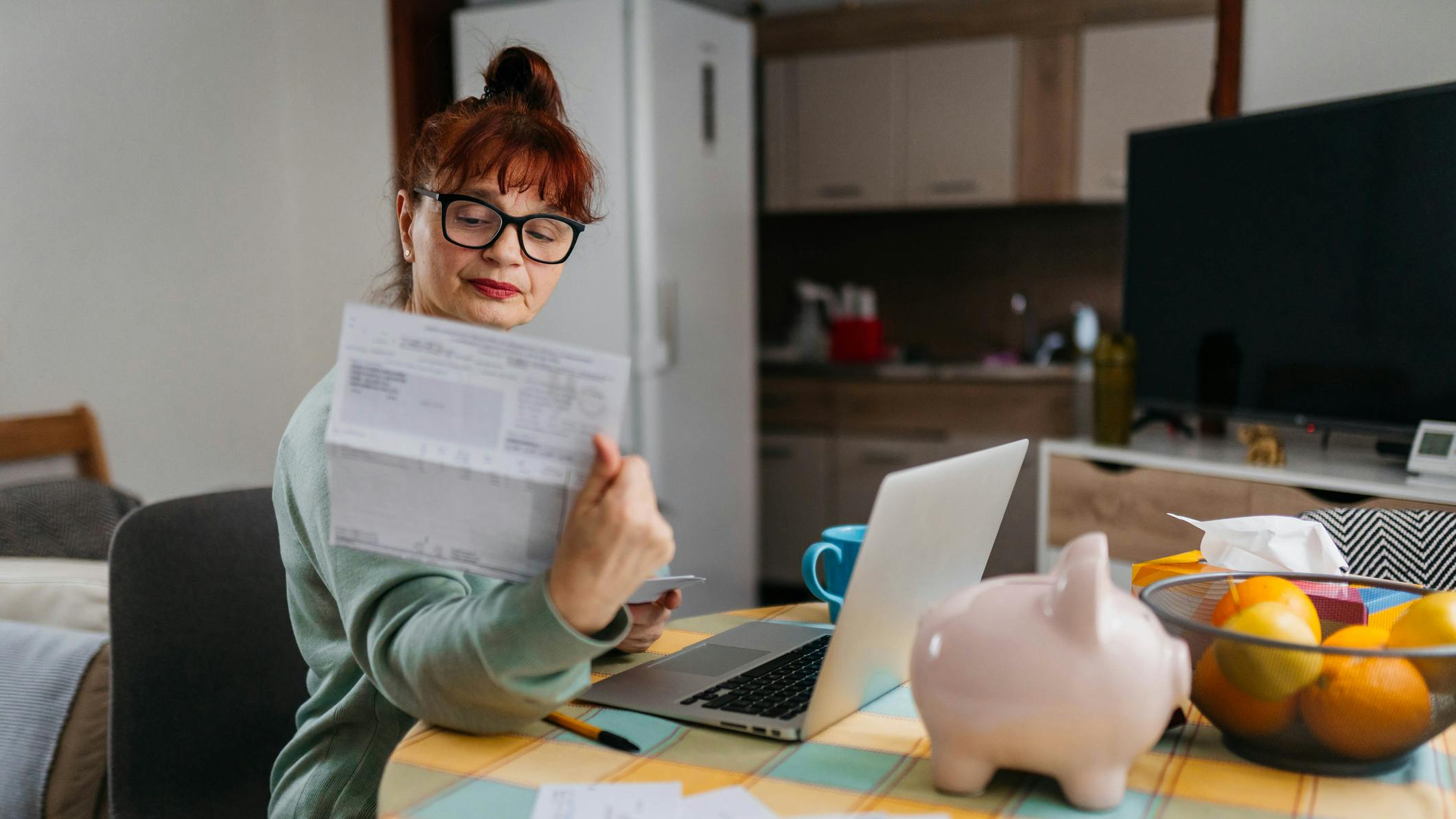 women looking at bill