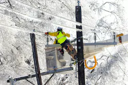 Lineworkers in a bucket truck Lineworkers in a bucket truck