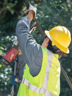worker with a crimper worker with a crimper
