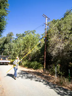 A worker with a hot stick. Acombination of structural risk reduction through undergrounding and enhanced situational awareness via sensors provides a layered defense that many T&D planners across the West are now striving to replicate A worker with a hot stick. Acombination of structural risk reduction through undergrounding and enhanced situational awareness via sensors provides a layered defense that many T&D planners across the West are now striving to replicate