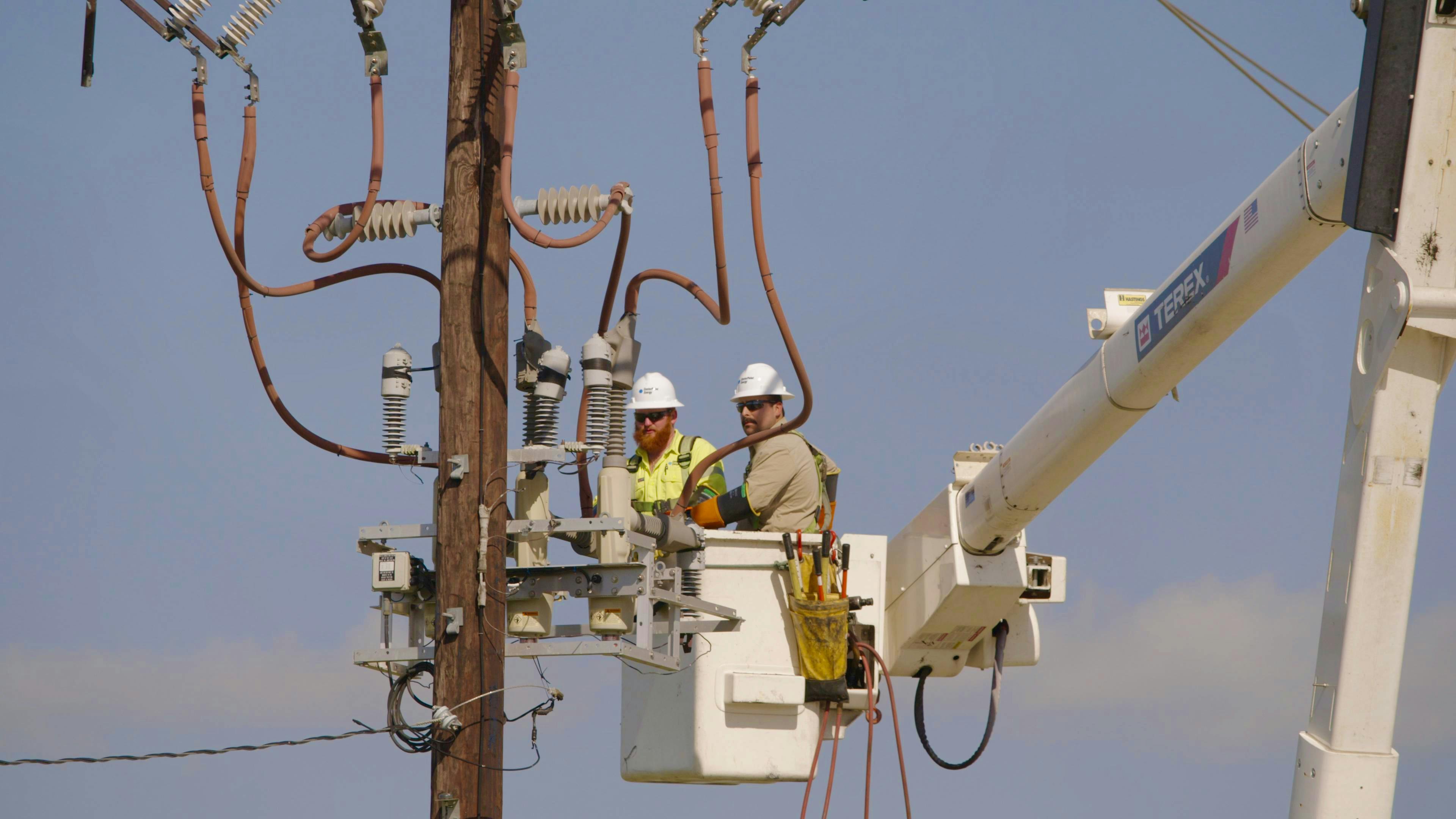 Crews install one of the more than 400 automation devices CenterPoint has installed across the Greater Houston area since 2024 to help reduce the impact of outages and improve restoration times.