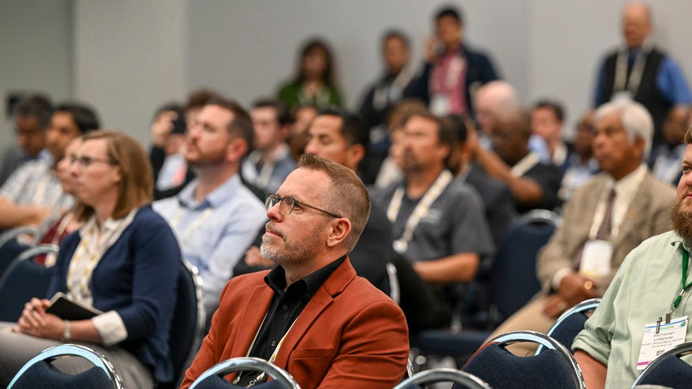 people in chairs in conference room