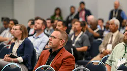 people in chairs in conference room people in chairs in conference room
