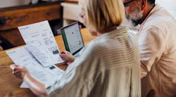 couple looking at energy bill couple looking at energy bill