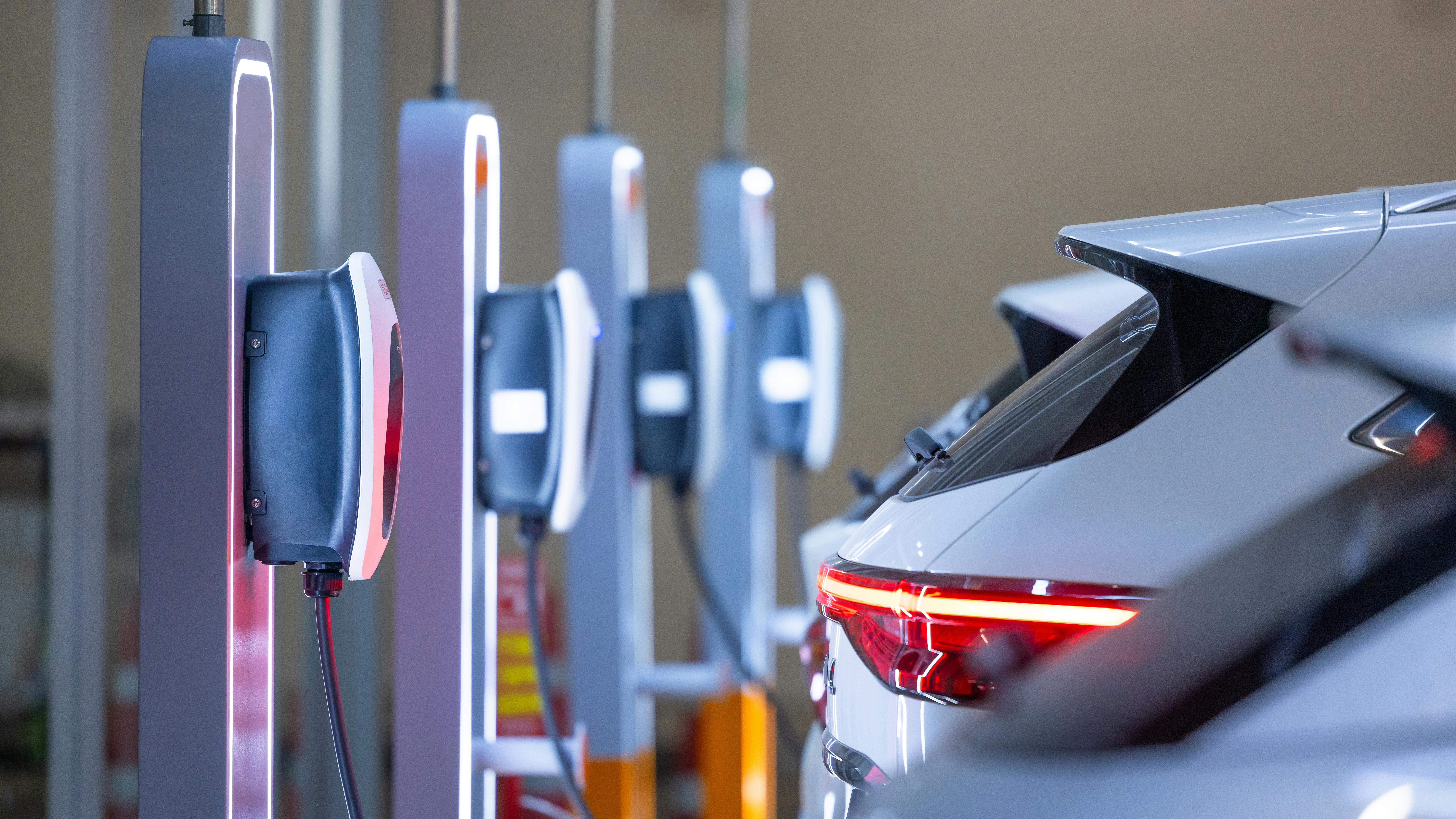 EV utility charger and electric car at charger station