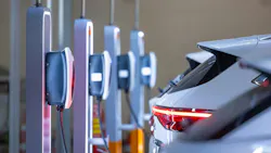 EV utility charger and electric car at charger station EV utility charger and electric car at charger station