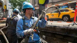 utility worker in manhole utility worker in manhole