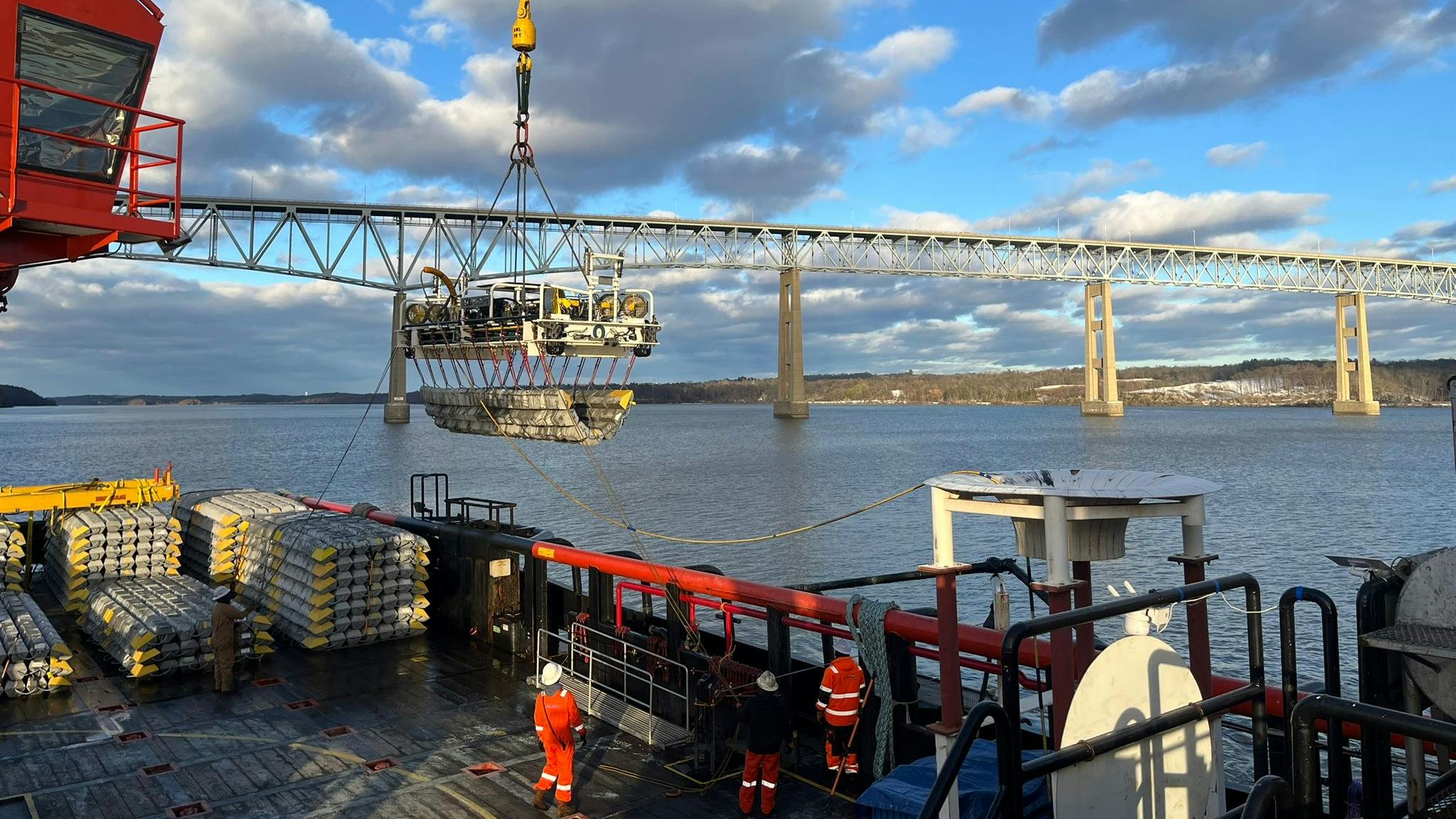 The HOS Mystique laying protective mattresses in the Hudson River.