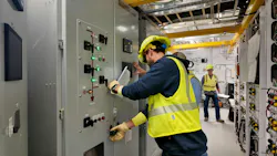 The team opens a local control cabinet during startup testing.