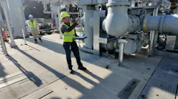 Dan Crockett examines the substation during startup testing.