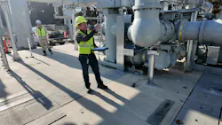 Dan Crockett examines the substation during startup testing.
