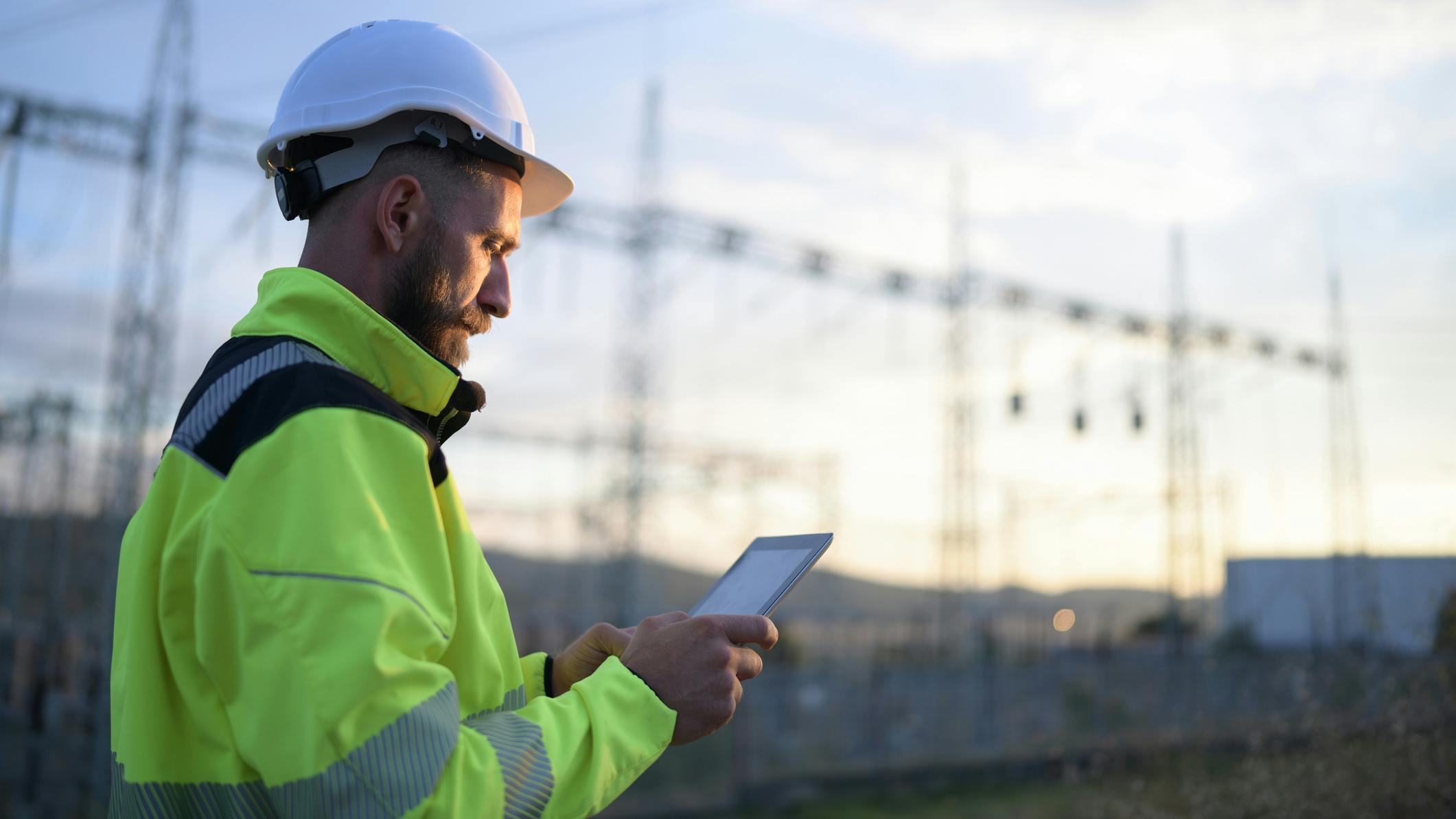engineer in front of power lines