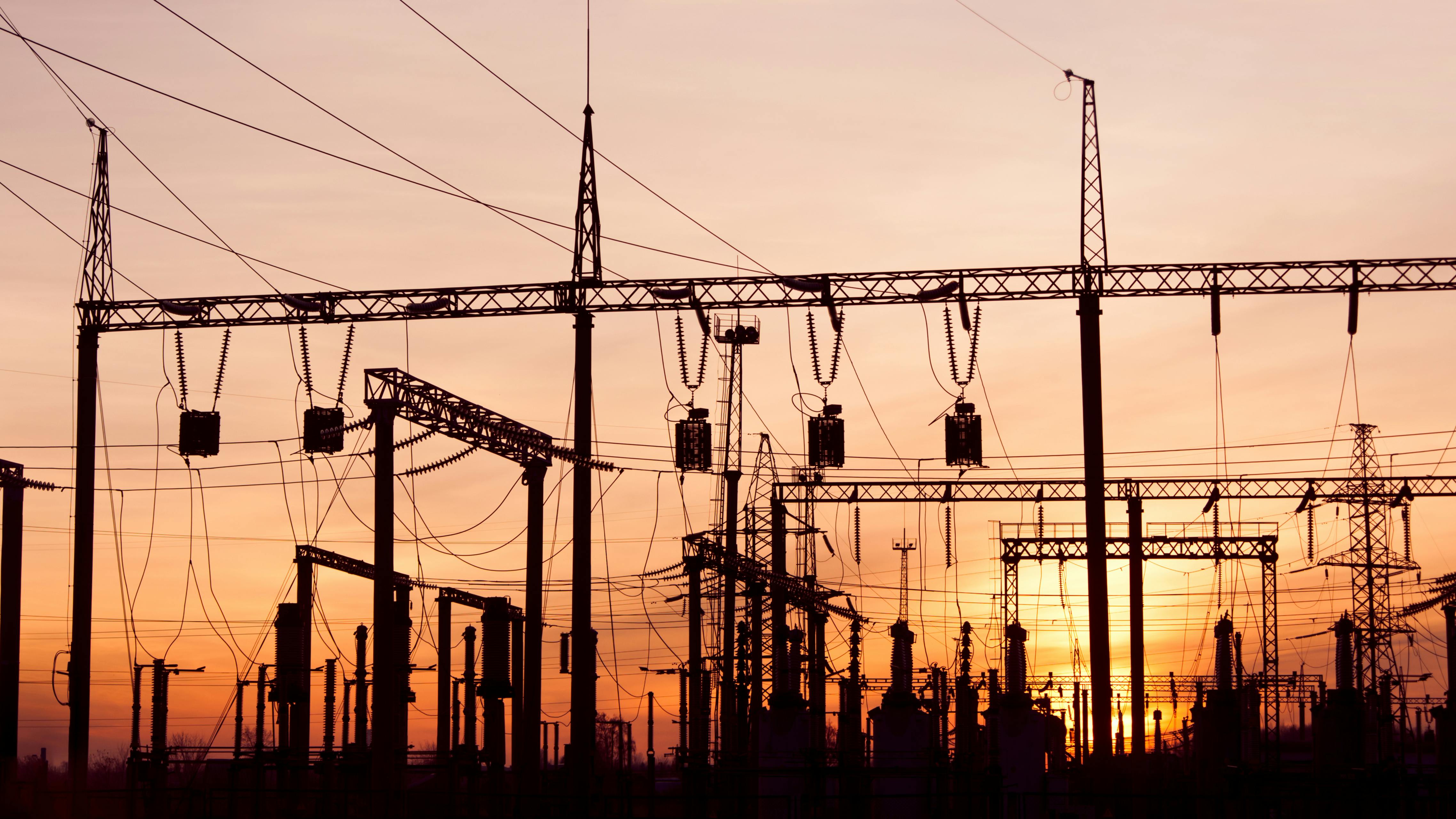 Electric substation and pylons with power lines.