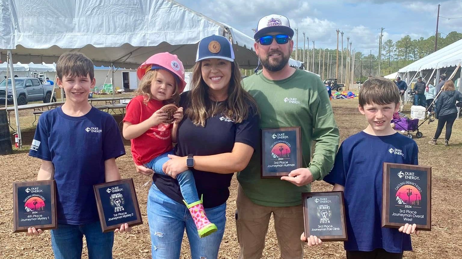 Brittany Burrell, shown with her husband, Daniel, and family, enjoys meeting other line families at the Lineman's Rodeo.