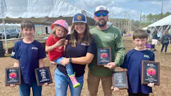 Brittany Burrell, shown with her husband, Daniel, and family, enjoys meeting other line families at the Lineman's Rodeo.