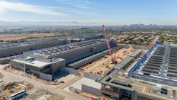 A data center under construction in Arizona, with Phoenix’s downtown visible in the background.