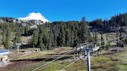 Ski lifts rest quietly at Mount Hood Meadows ski resort near Government Camp, Ore., May 20. Portland General Electric is undergrounding approximately seven miles of powerlines near Government Camp to protect Timberline, Mt. Hood Meadows, Skibowl and the surrounding communities from the increasing threat of wildfire