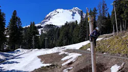 A contractor installs new lights at Mount Hood Meadows ski resort near Government Camp, Ore. Portland General Electric is undergrounding approximately seven miles of powerlines near Government Camp to protect Timberline, Mount Hood Meadows, Skibowl and the surrounding communities from the increasing threat of wildfire.