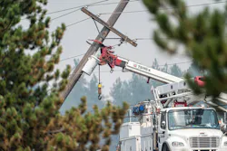 Avista Utilities crews secure an electric pole during the emergency response to fires in Spokane County, Washington.