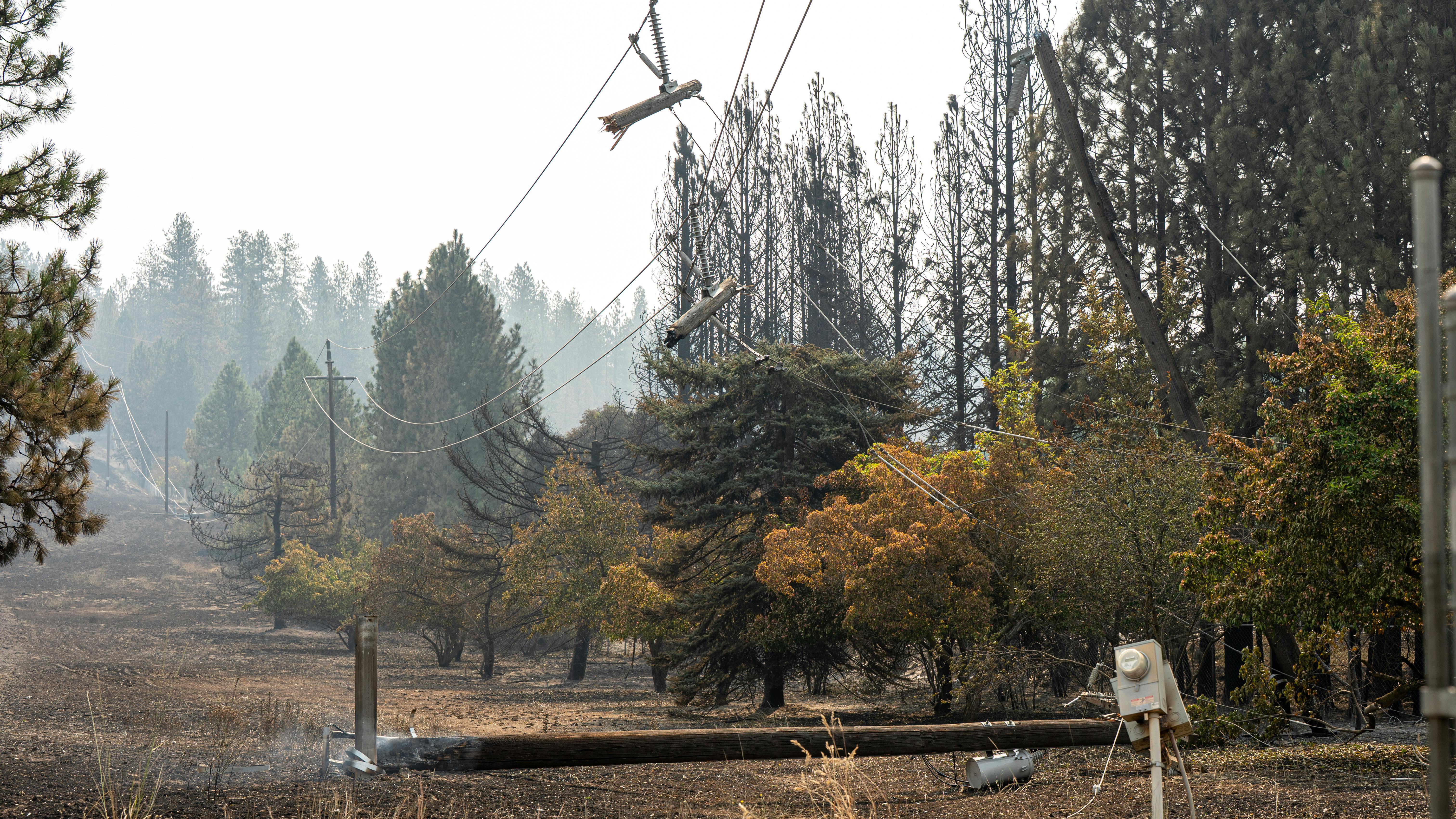 Damaged Avista Utilities electric equipment in the wake of area wildfires in Spokane County, Washington.