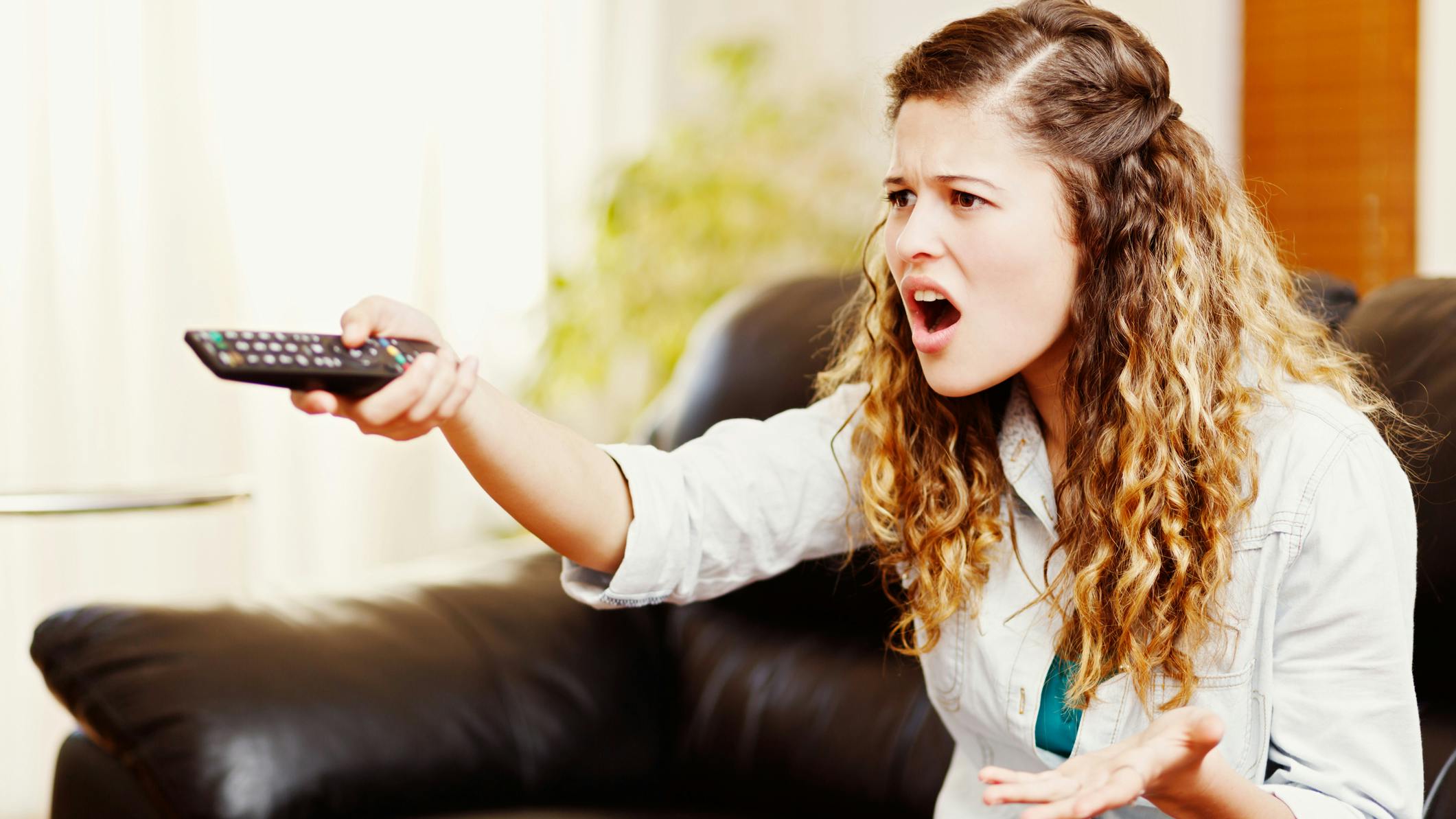 angry woman in front of tv
