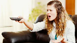 angry woman in front of tv