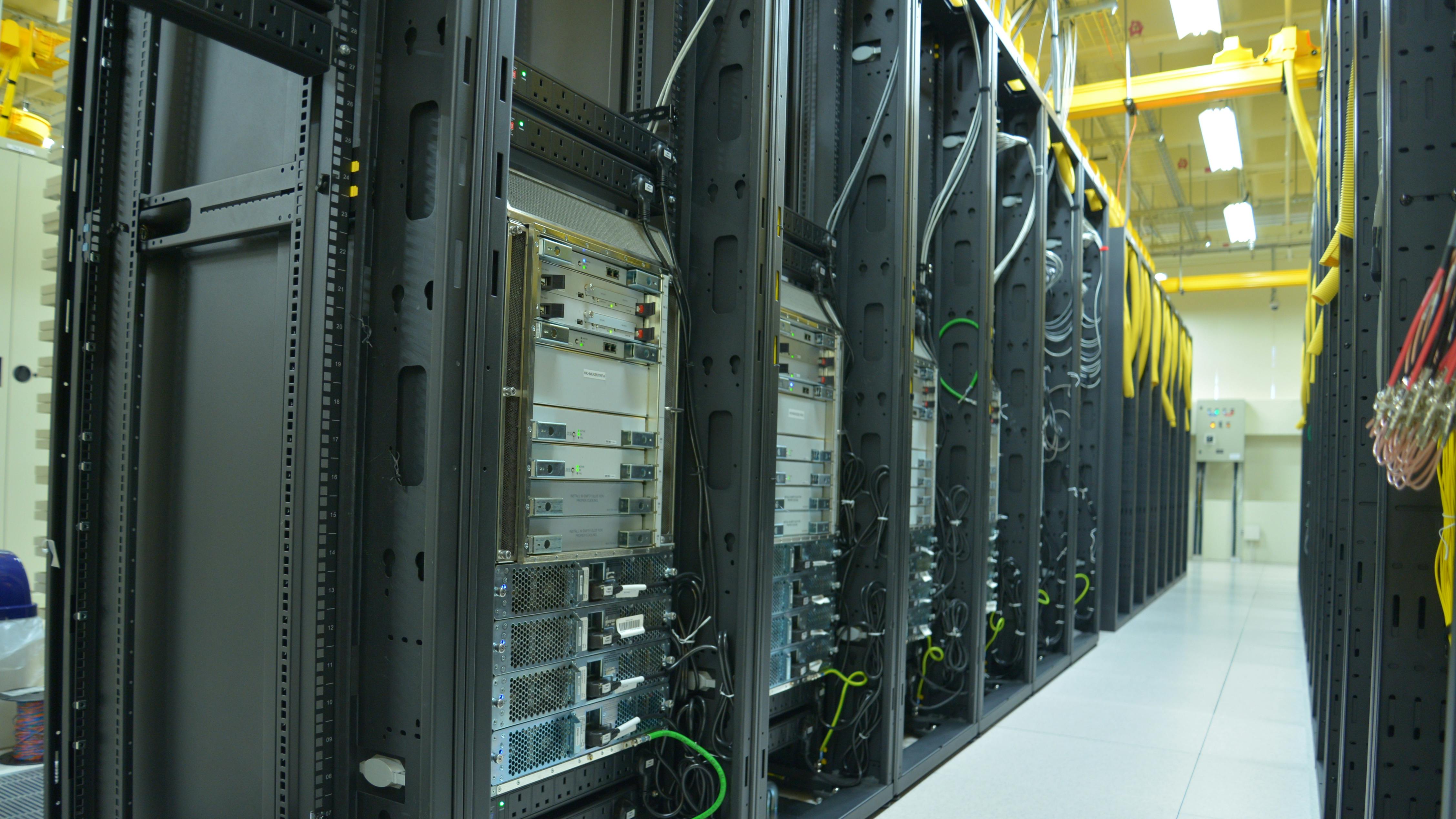 Data Center rack and stacks. A typical setup of Data center. Communication racks in a datacenter filled with switches and routers that keep all the servers connected.