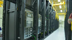 Data Center rack and stacks. A typical setup of Data center. Communication racks in a datacenter filled with switches and routers that keep all the servers connected.