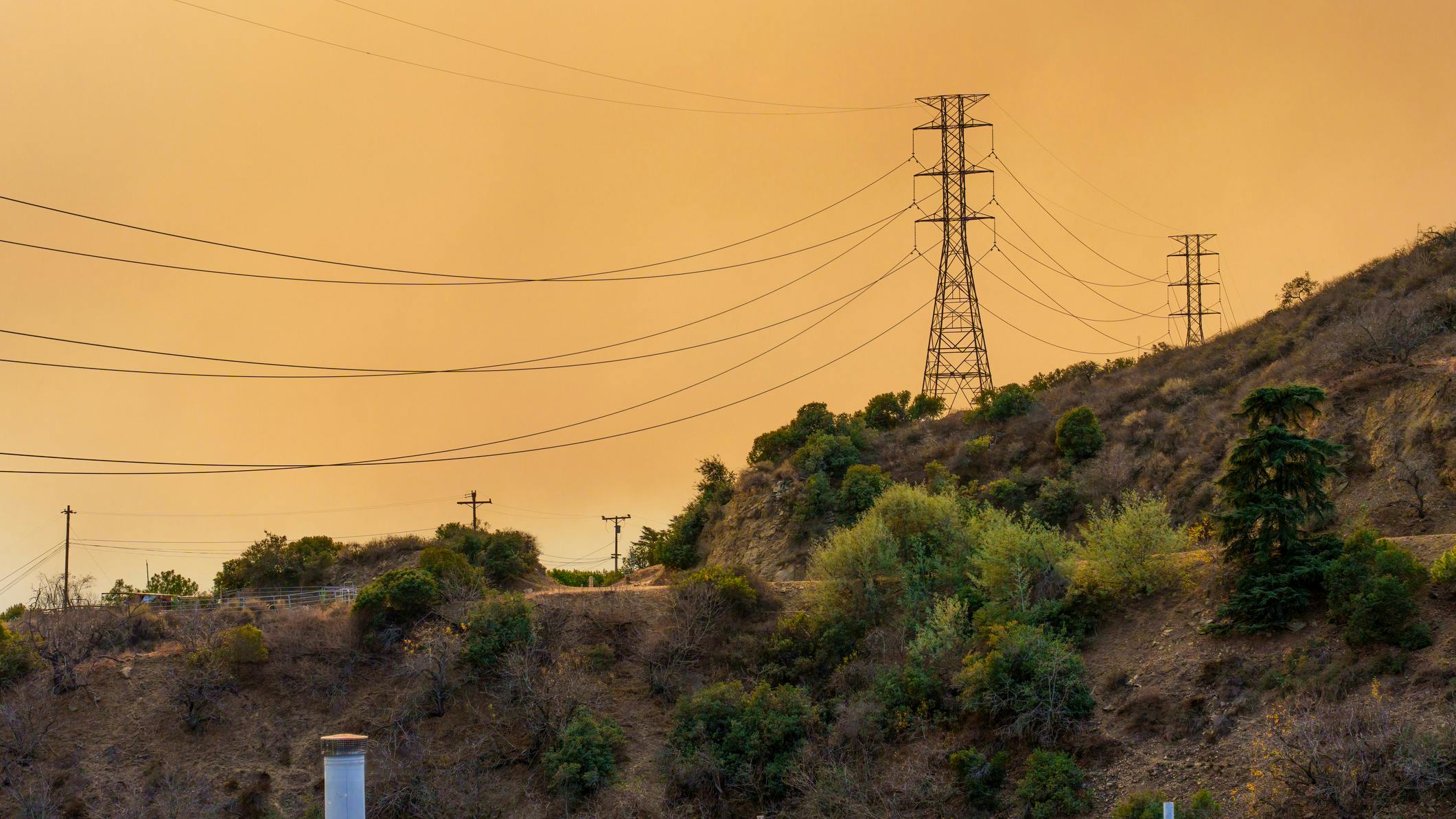 power line against smoky sky