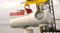 Image of a wind turbine nacelle being lifted into place by heavy-lift crane. | Credit: SSE Renewables