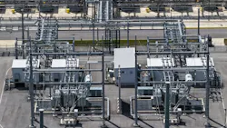 Existing power utility substation with transformers and high-voltage power lines. The type of infrastructure GridCARE aims to optimize and unlock capacity.