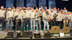 The winning team from SCE/IBEW Local 47 celebrates the victory along with their teammates, families and supporters.