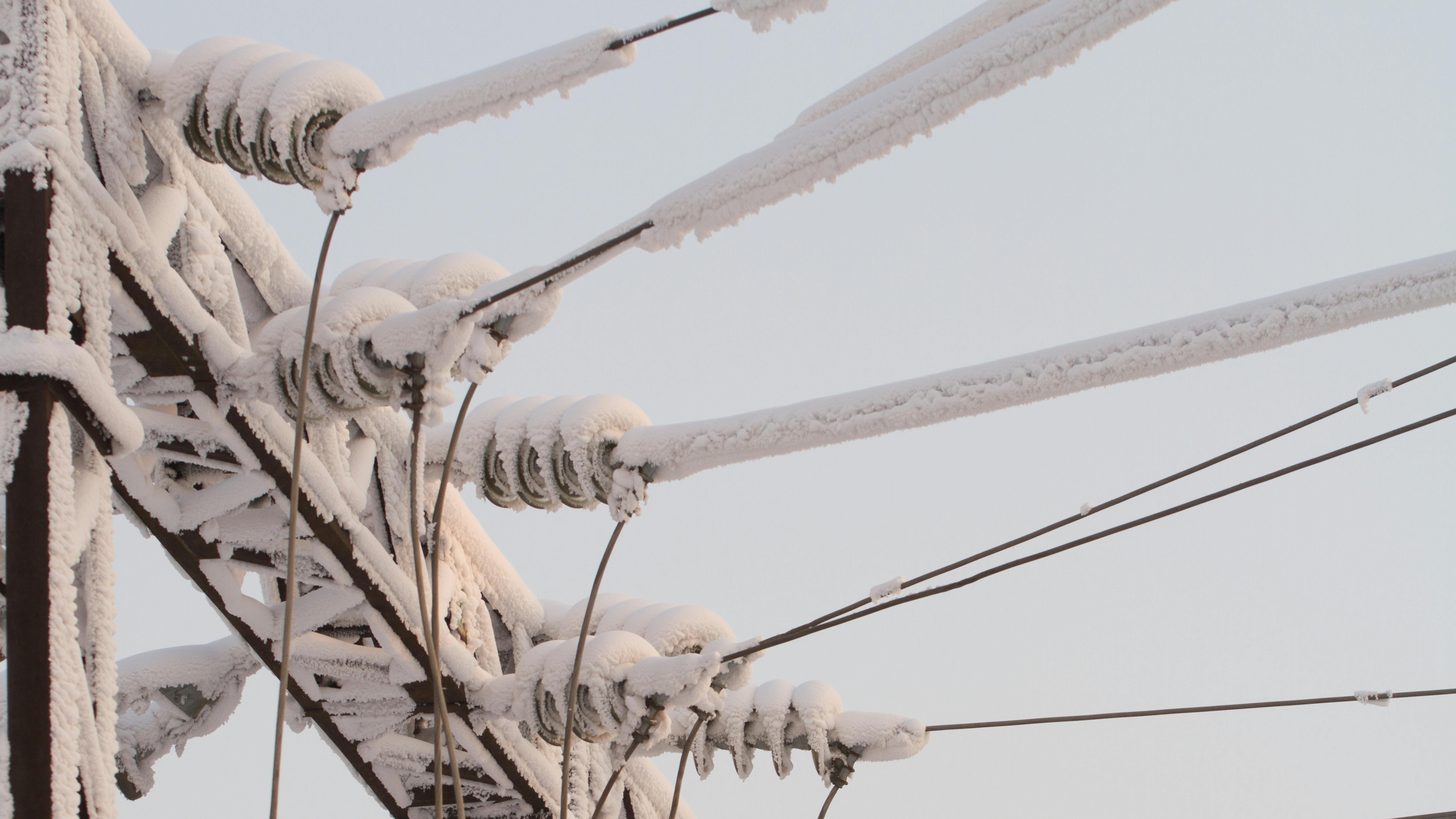 Snow-covered high voltage lines.