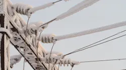 Snow-covered high voltage lines.