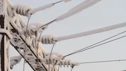 Snow-covered high voltage lines.